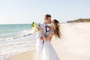 Couple kissing on the sand at Bradenton Beach