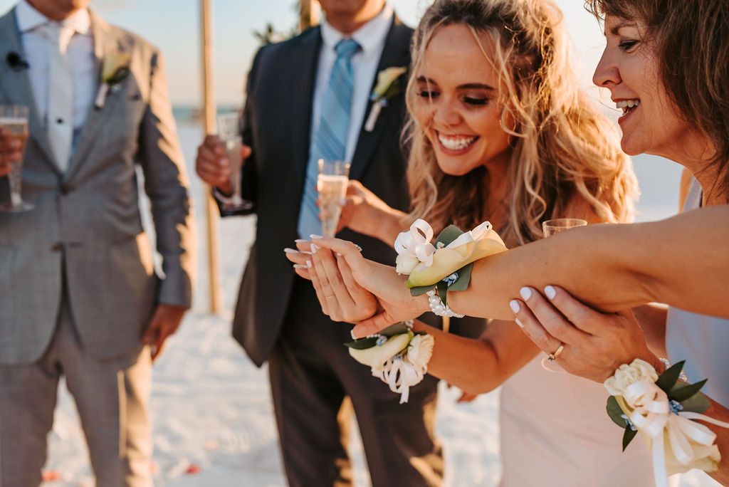 Guests toasting with champagne and corsages at Nokomis Beach