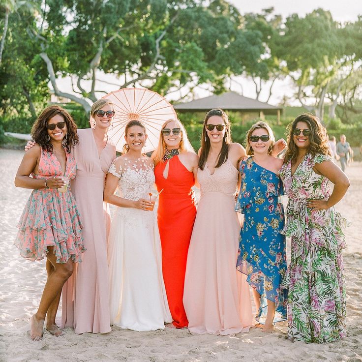 Bride surrounded by guests in summer dresses at a garden celebration