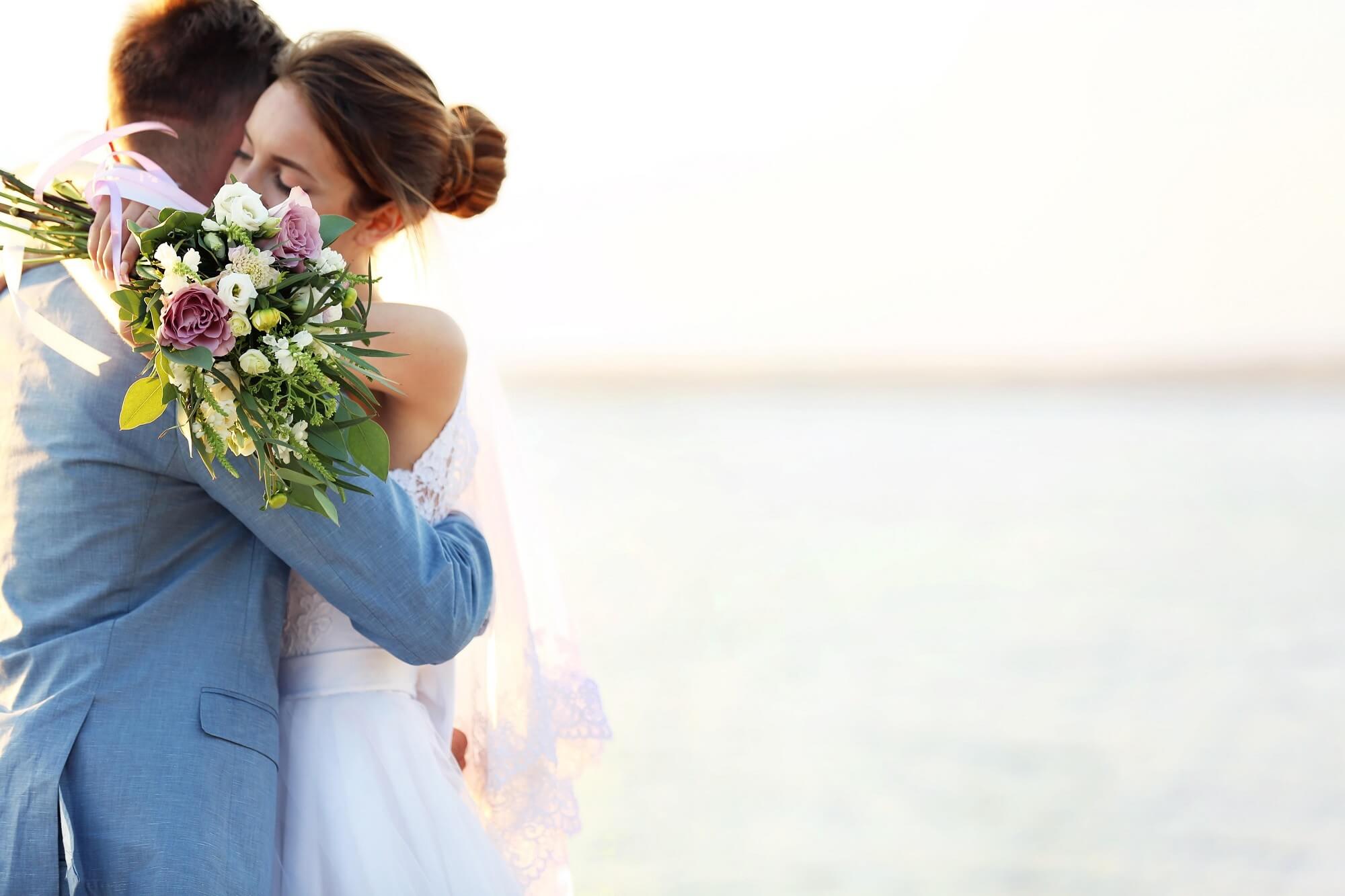Beach wedding ceremony arch on the Gulf Coast at golden hour